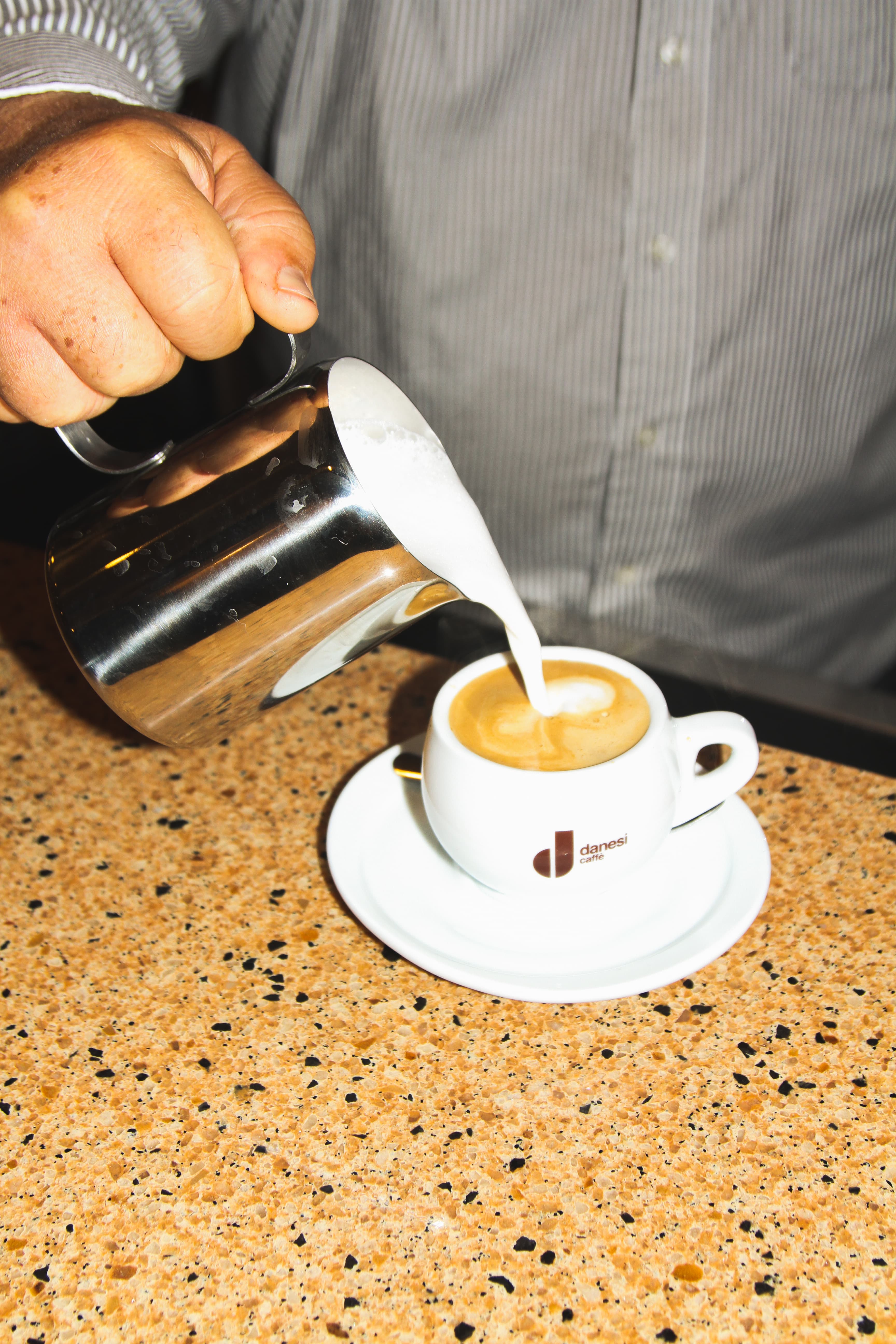 A cappuccino poured by hand at D'Corato Ristorante